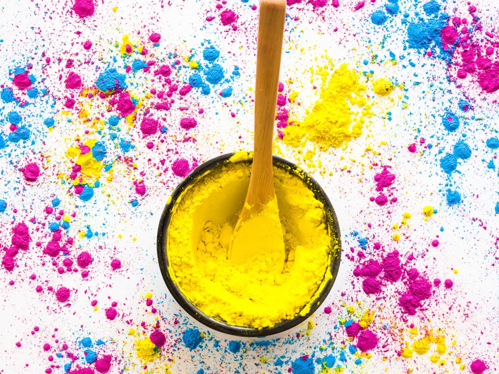 bowl-yellow-holi-powder-with-spoon-white-background(1).jpg
